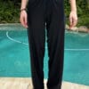 Full view of loose-fit swim pants with the leg ties open for a relaxed, wide-leg aesthetic.